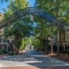 metal archways over brick walking path